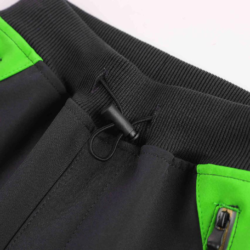 Chlapecké softshellové kalhoty nezateplené Kugo HK2870, černé se zelenou