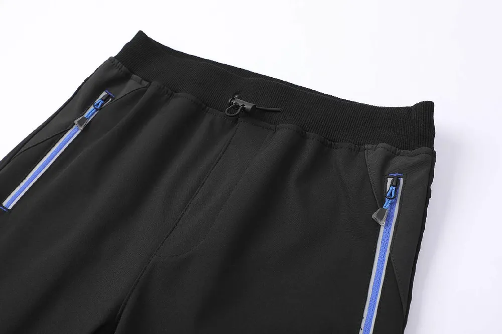 Chlapecké softshellové kalhoty nezateplené Kugo HK5657, černé