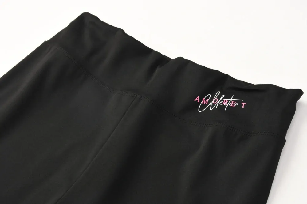 Dámské funkční legíny Kugo JK8618, černé / zelený nápis