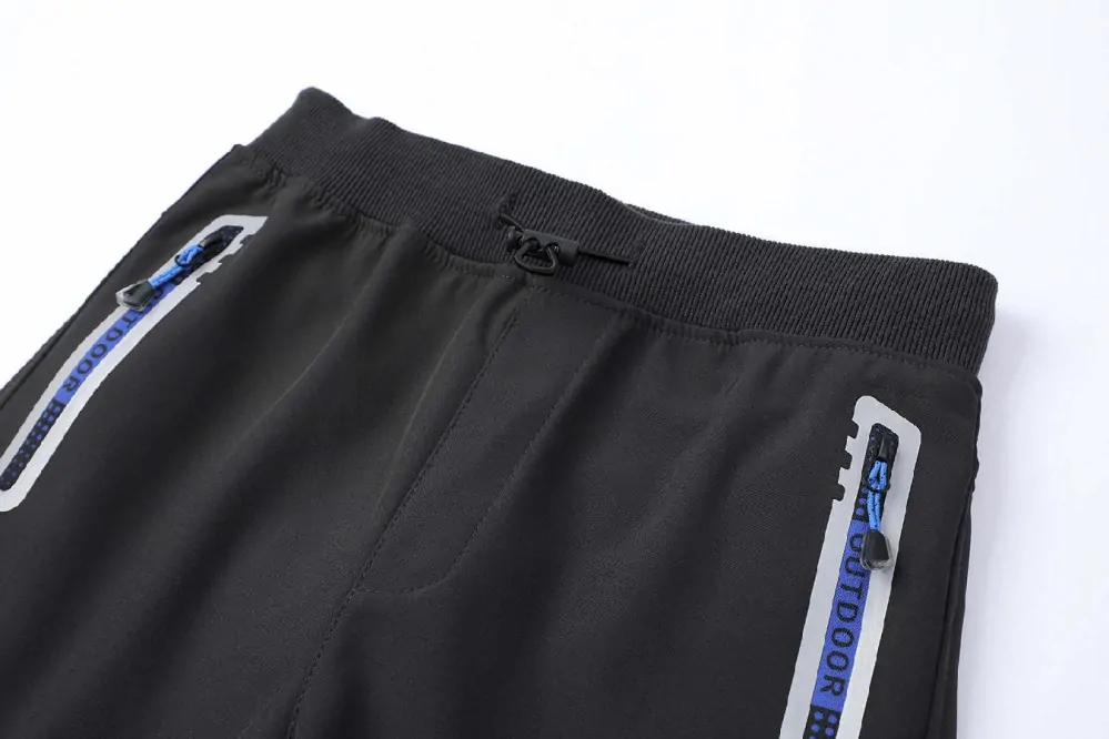 Chlapecké softshellové kalhoty nezateplené Kugo HK5655 tm. šedé