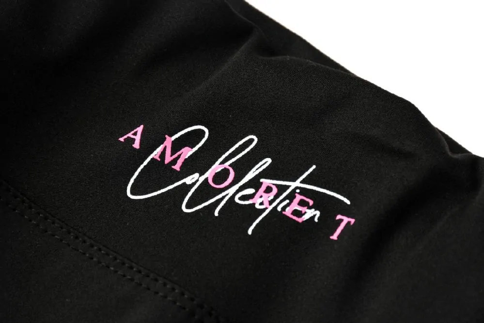 Dámské funkční legíny Kugo JK8618, černé / zelený nápis