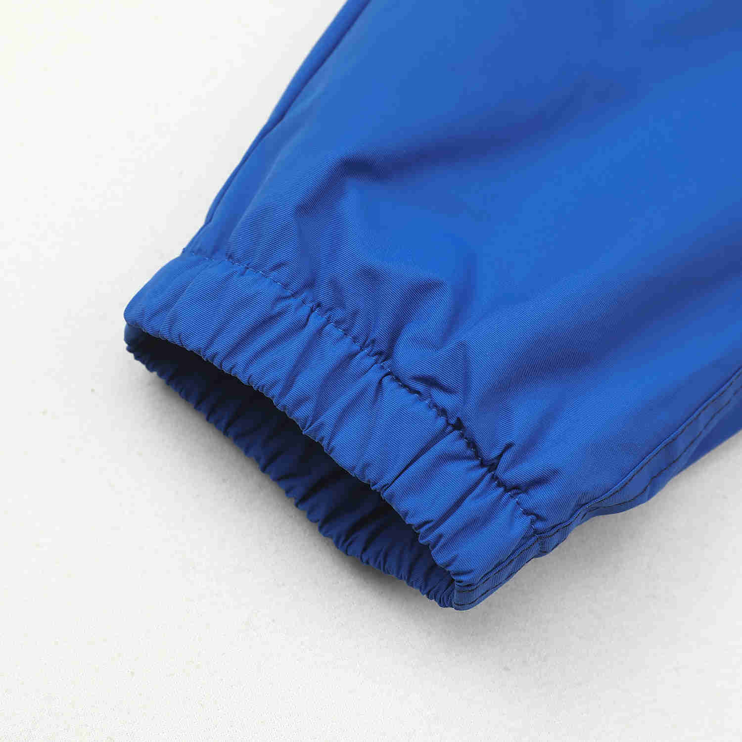 Zateplené šusťákové kalhoty KUGO K6970 petrolejové