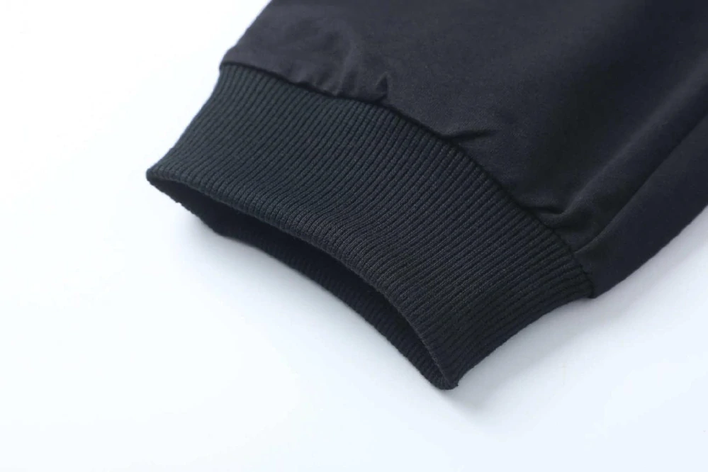 Chlapecké tepláky Kugo FT7053 černé / zelená aplikace