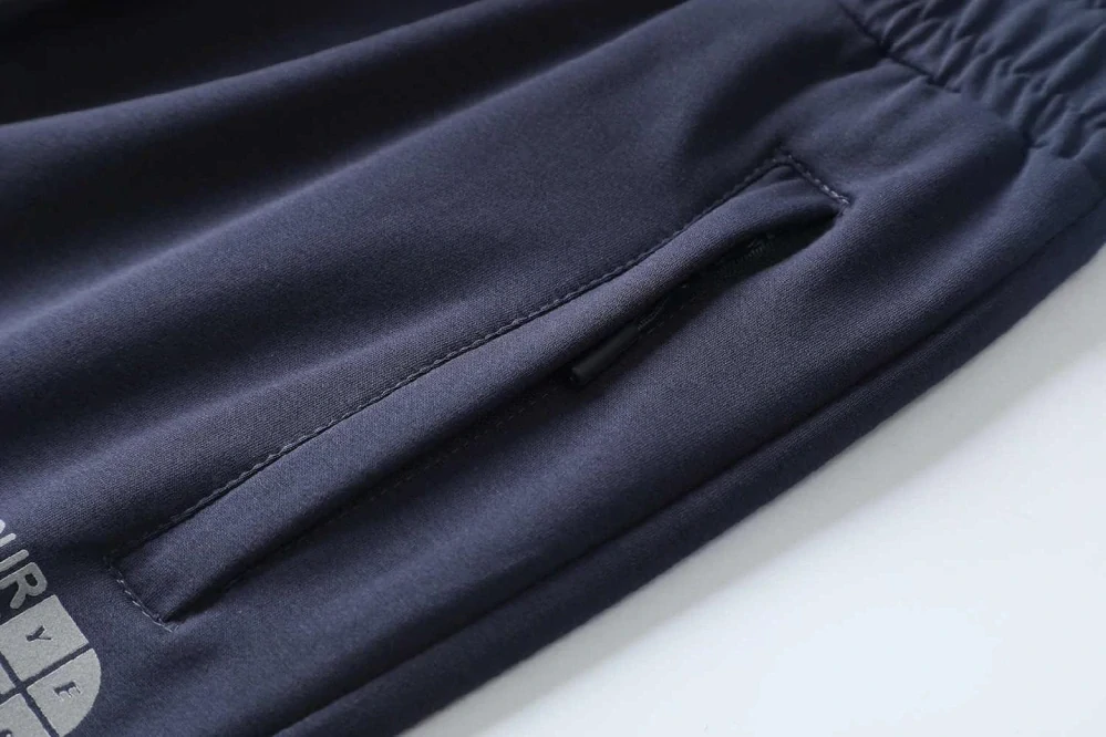 Moderní pánské rovné tepláky Kugo ZT8843 tmavě modré